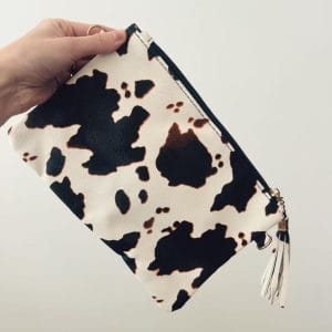 Handcrafted Nguni purse made from genuine cowhide in a black and white hide with a zip